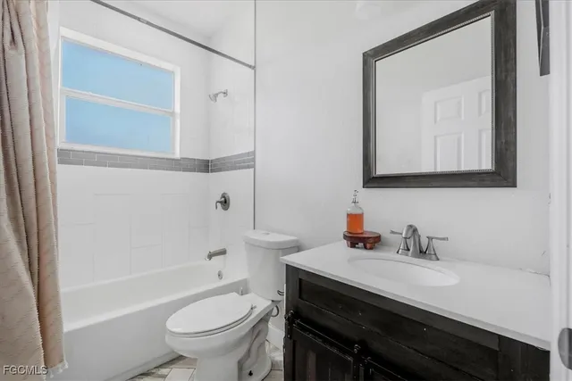 a room with a bed and a window