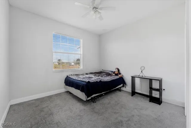 a bedroom with a bed and a fireplace