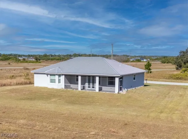 a view of a swimming pool and a yard