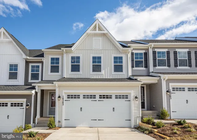 a view of a building with a yard