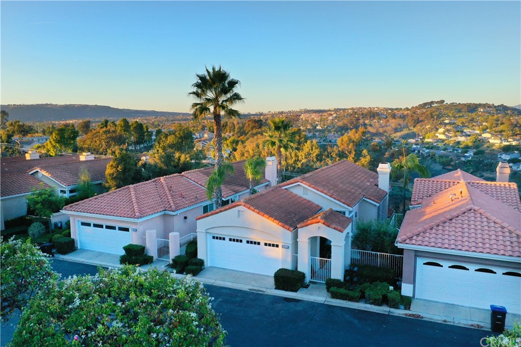 an aerial view of residential houses and city street