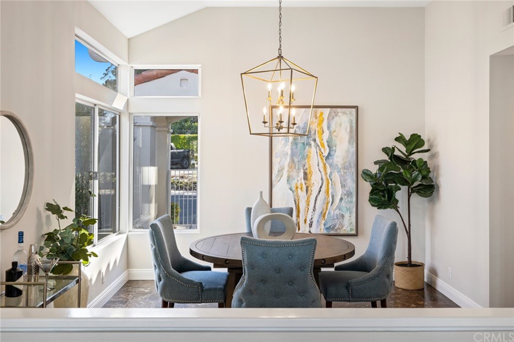 24955 Seagate Drive Dana Point, CA 92629 - Photo 15 of 39 a view of a dining room with furniture and potted plant
