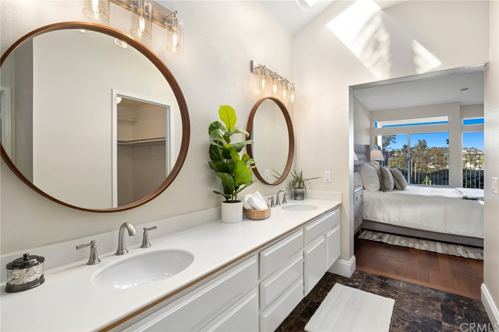 24955 Seagate Drive Dana Point, CA 92629 - Photo 18 of 39 a bathroom with a double vanity sink and a mirror