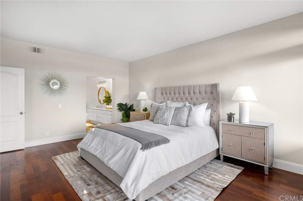 24955 Seagate Drive Dana Point, CA 92629 - Photo 19 of 39 a bedroom with a bed and wooden floor