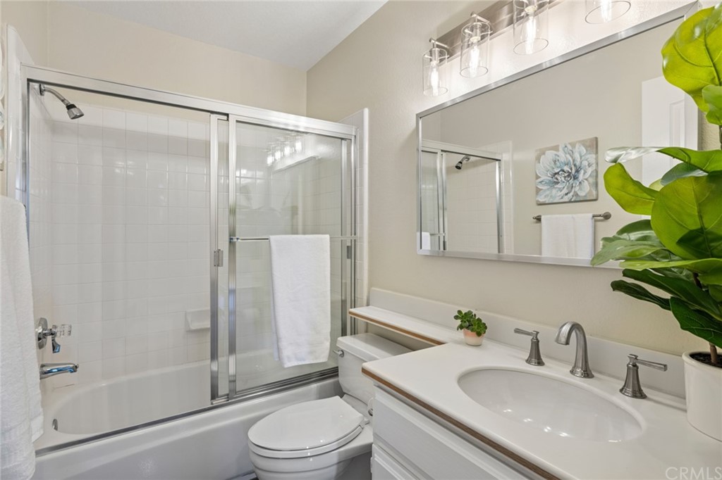 24955 Seagate Drive Dana Point, CA 92629 - Photo 22 of 39 a bathroom with a sink toilet and shower