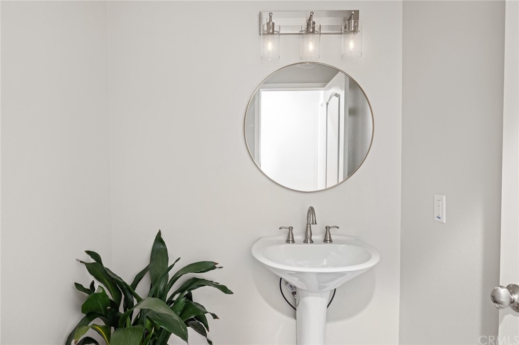24955 Seagate Drive Dana Point, CA 92629 - Photo 23 of 39 a bathroom with a sink and a mirror