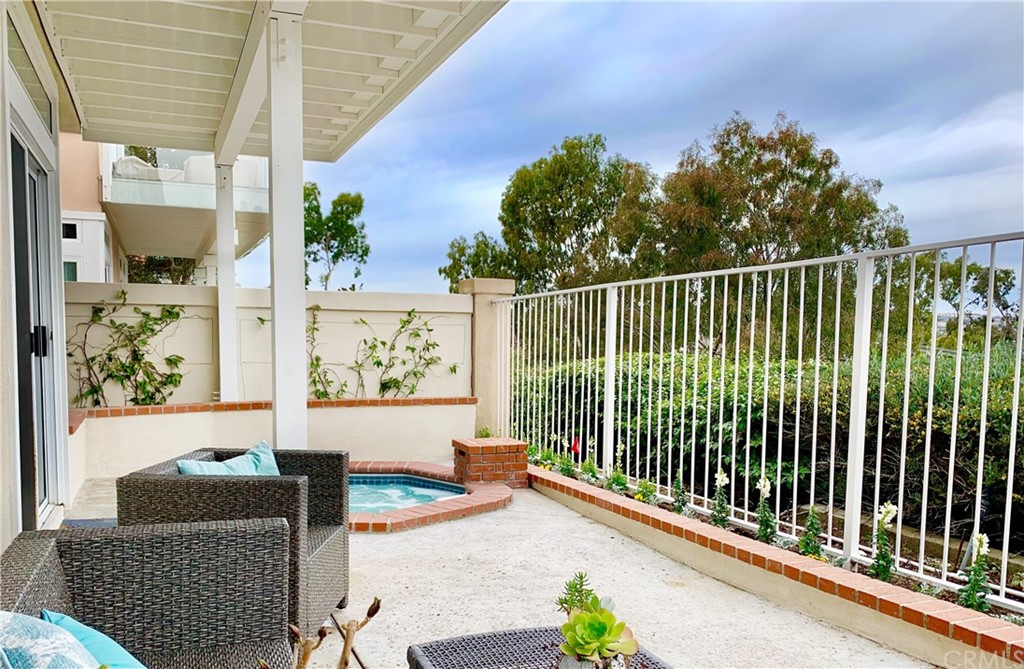 24955 Seagate Drive Dana Point, CA 92629 - Photo 32 of 39 a balcony with table and chairs