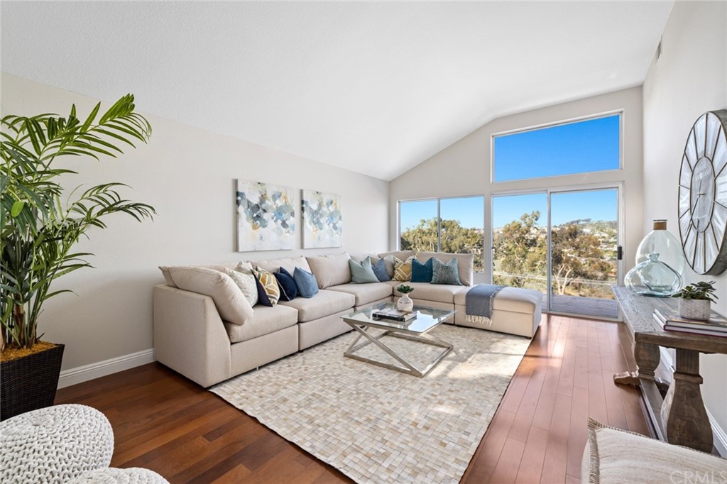 24955 Seagate Drive Dana Point, CA 92629 - Photo 4 of 39 a living room with furniture rug and wooden floor