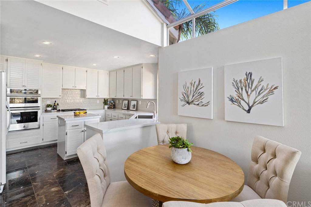 24955 Seagate Drive Dana Point, CA 92629 - Photo 5 of 39 a open dining room with furniture and wooden floor