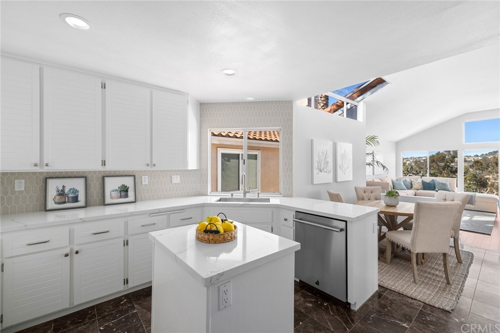 24955 Seagate Drive Dana Point, CA 92629 - Photo 7 of 39 a kitchen that has a sink and a stove in it
