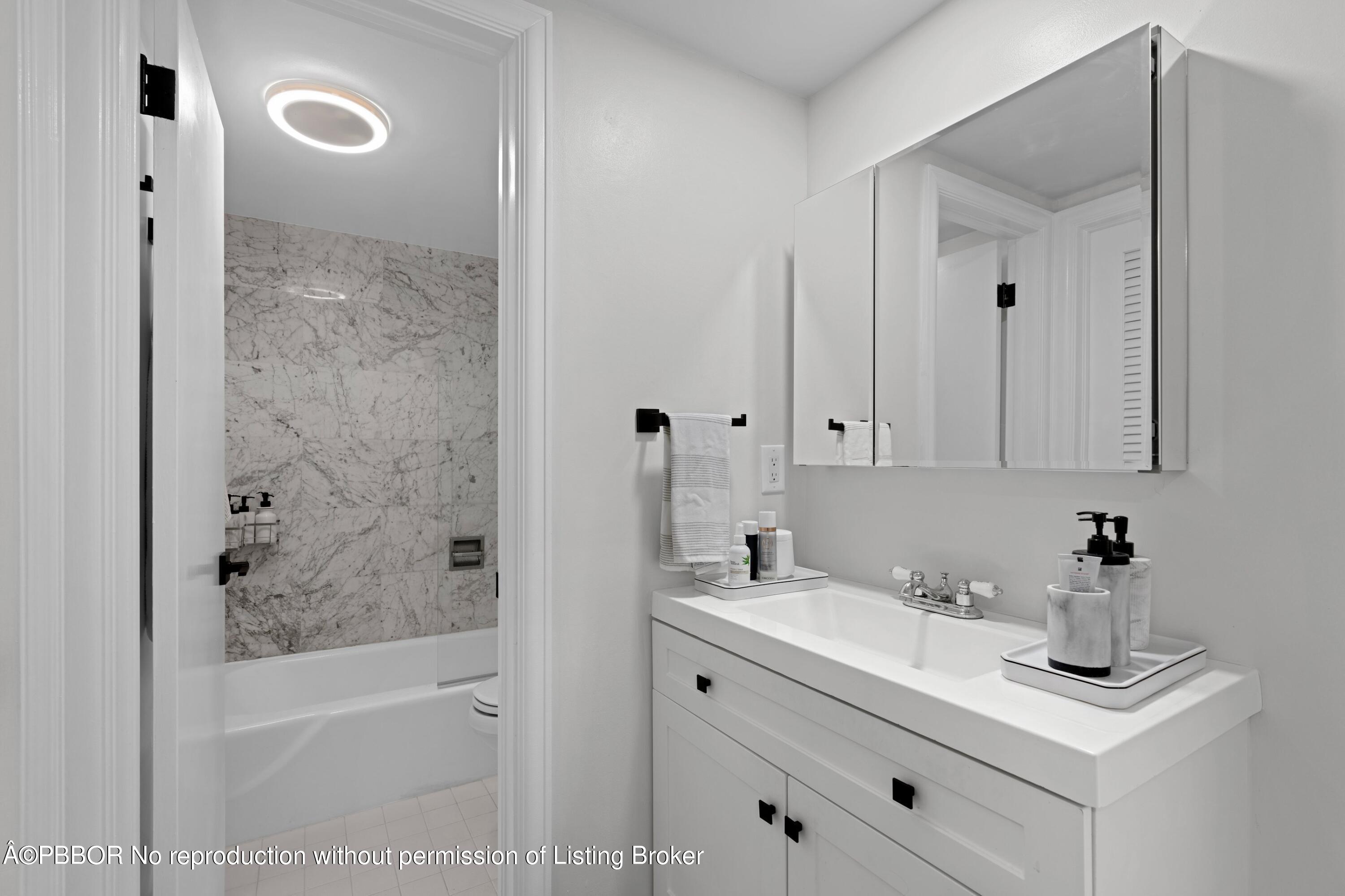 2195 Ibis Isle Road, Unit 1 Palm Beach, FL 33480 - Photo 14 of 38 a bathroom with a sink a toilet and shower
