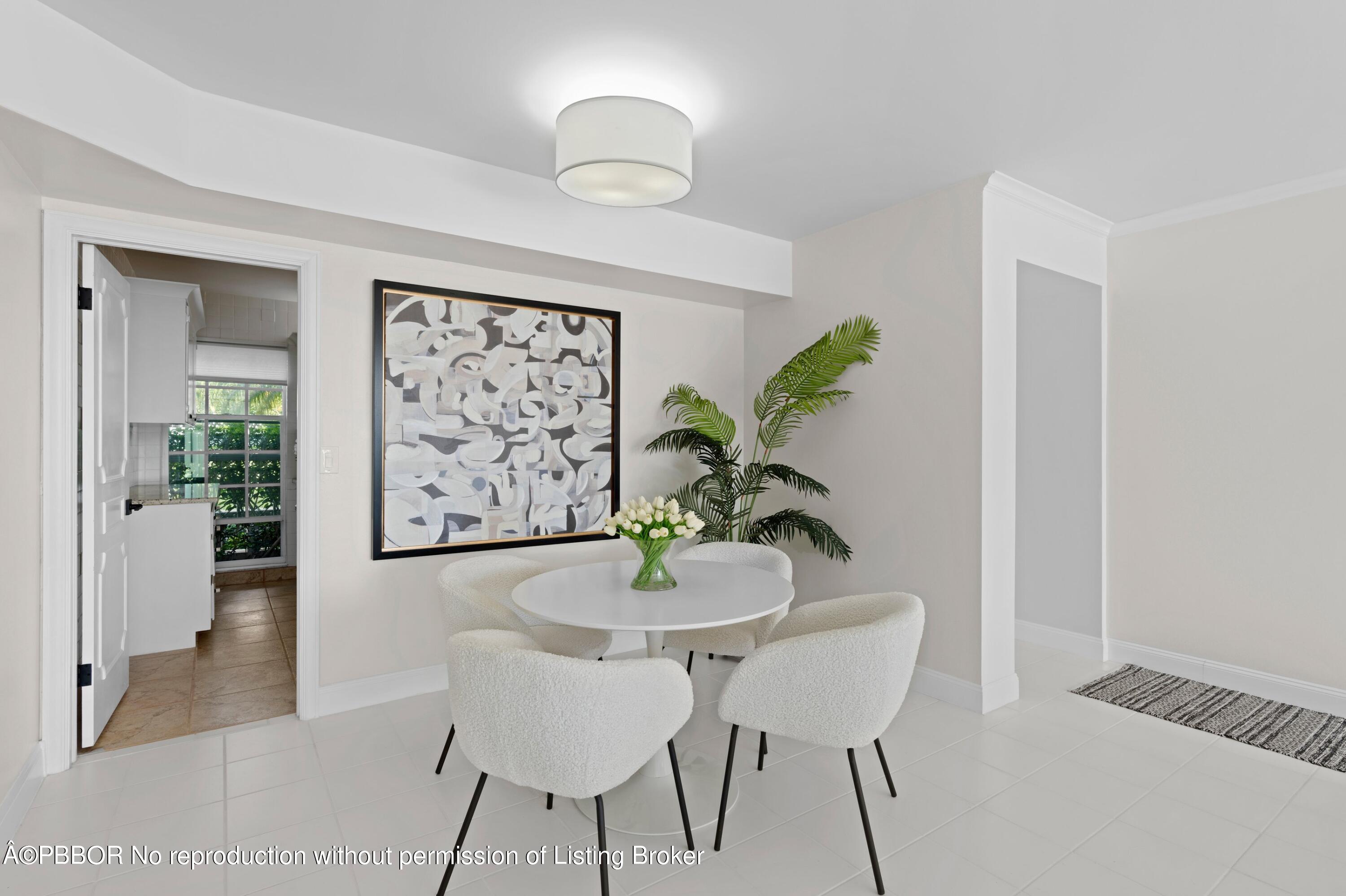 2195 Ibis Isle Road, Unit 1 Palm Beach, FL 33480 - Photo 18 of 38 a dining room with furniture and window