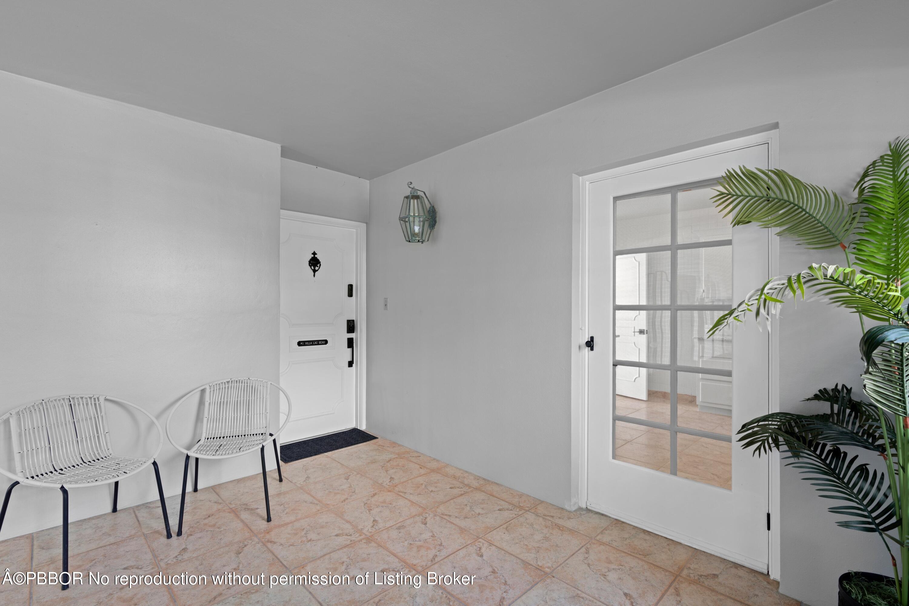 2195 Ibis Isle Road, Unit 1 Palm Beach, FL 33480 - Photo 23 of 38 a view of room with furniture and a potted plant