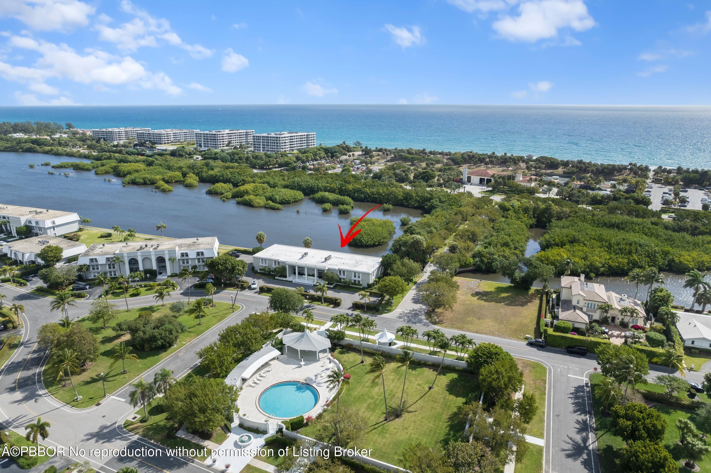2195 Ibis Isle Road, Unit 1 Palm Beach, FL 33480 - Photo 32 of 38 an aerial view of a city with lots of residential buildings ocean and mountain view in back