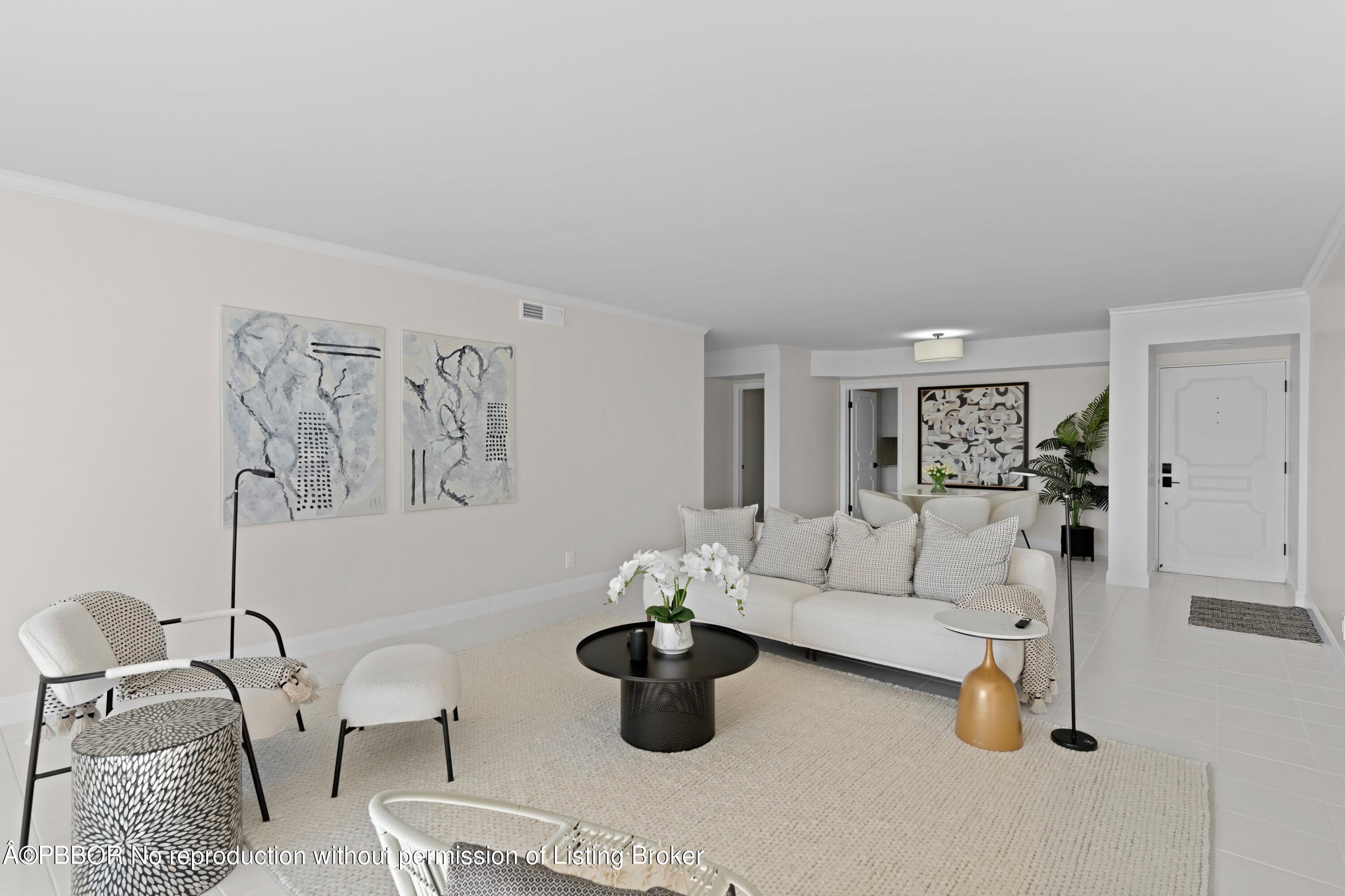 2195 Ibis Isle Road, Unit 1 Palm Beach, FL 33480 - Photo 8 of 38 a living room with furniture and white walls