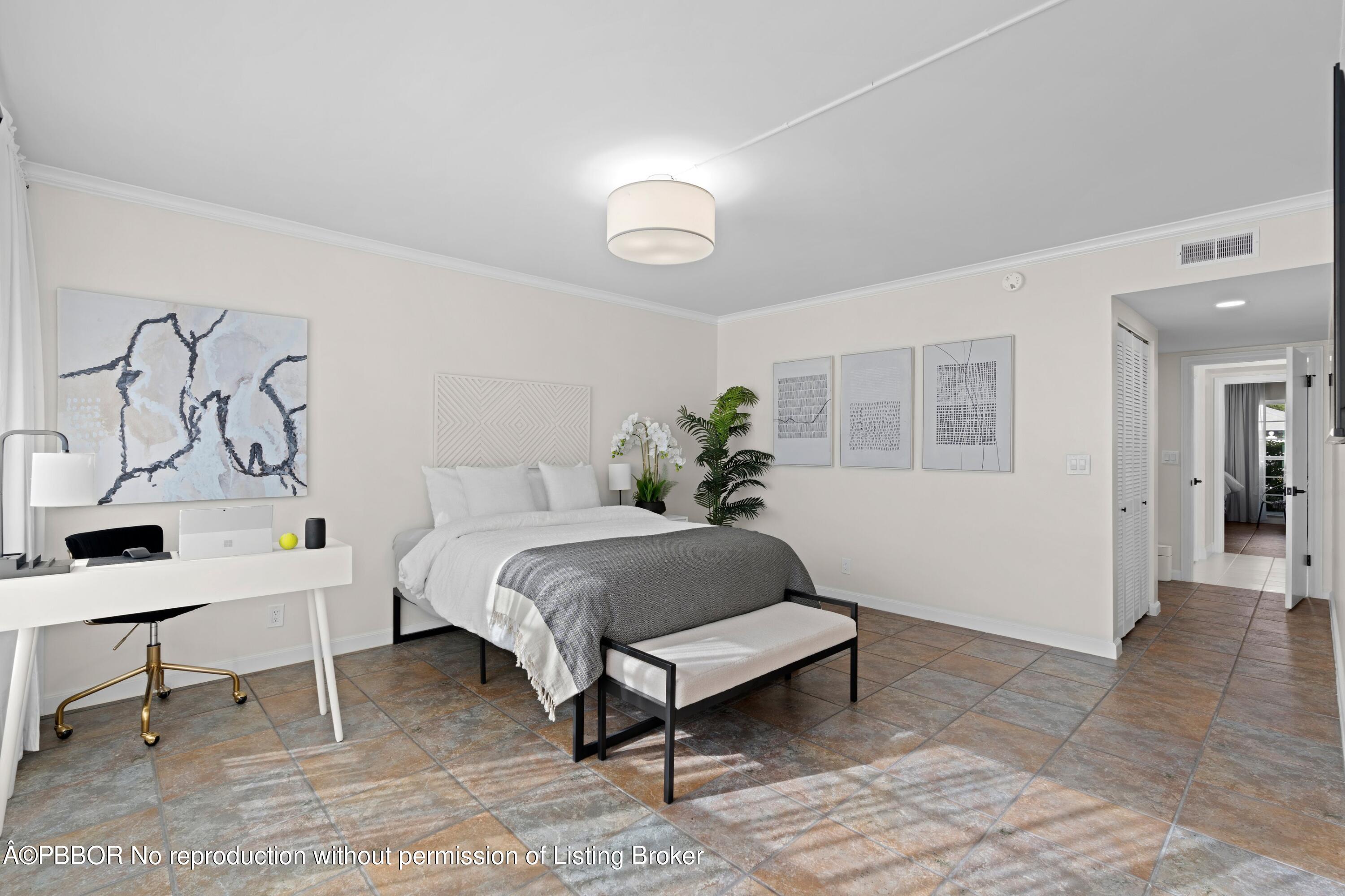 2195 Ibis Isle Road, Unit 1 Palm Beach, FL 33480 - Photo 10 of 38 a spacious bedroom with a bed and a table