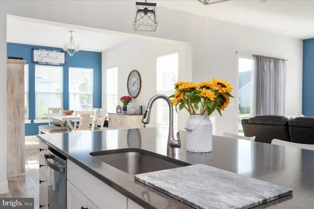 a bedroom with a bed window and a table