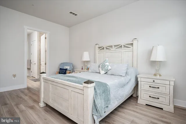 a bedroom with a bed and chair