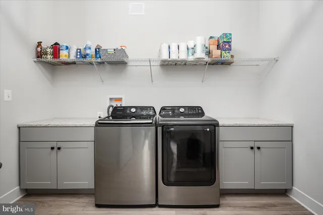 an aerial view of residential building with green space