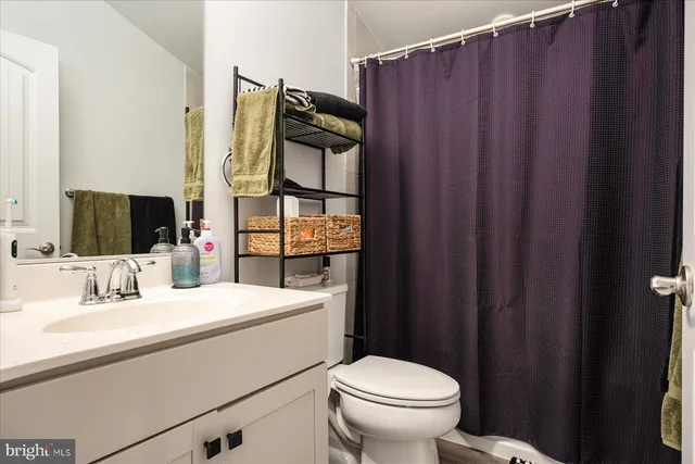 a view of a patio with couches table and chairs and potted plants