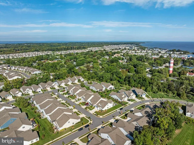 a view of a patio with dining table and chairs
