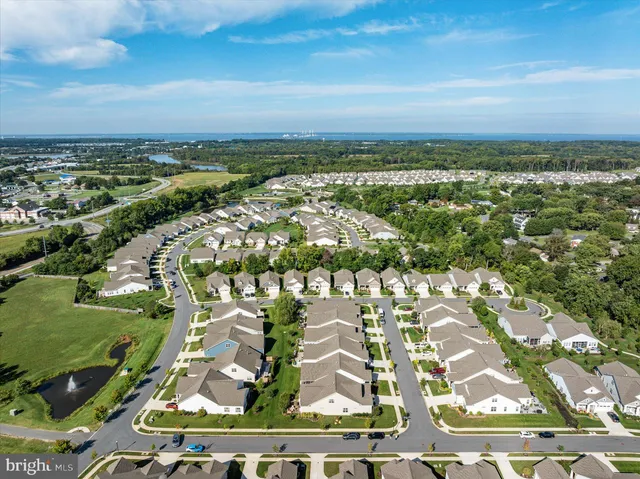 an aerial view of a house with yard swimming pool and outdoor seating