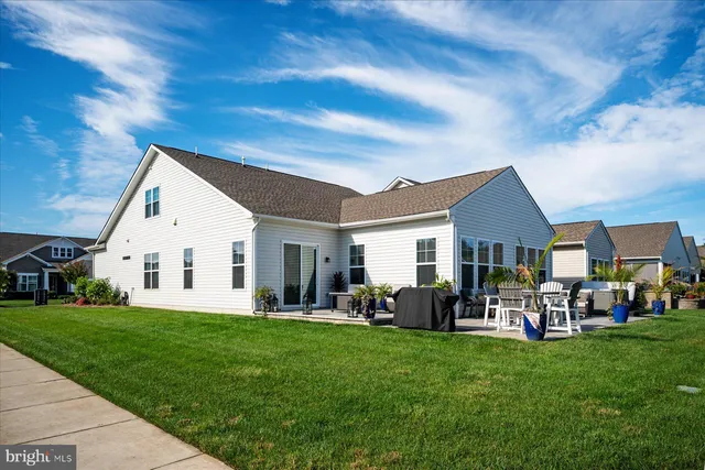 a view of a swimming pool and a yard