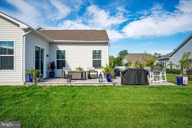 an aerial view of a house with outdoor space