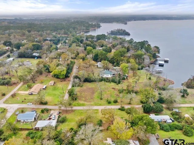 a view of a field with an trees