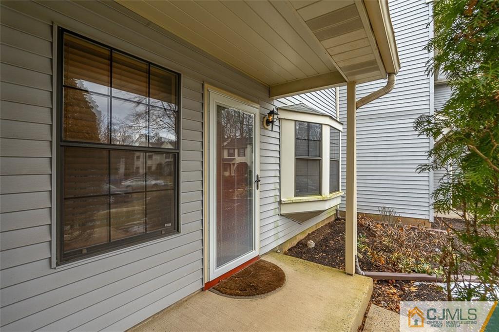 605 Timber Oaks Road, Unit 605 Edison, NJ 08820 - Photo 3 of 22 a view of a house with a door and a porch