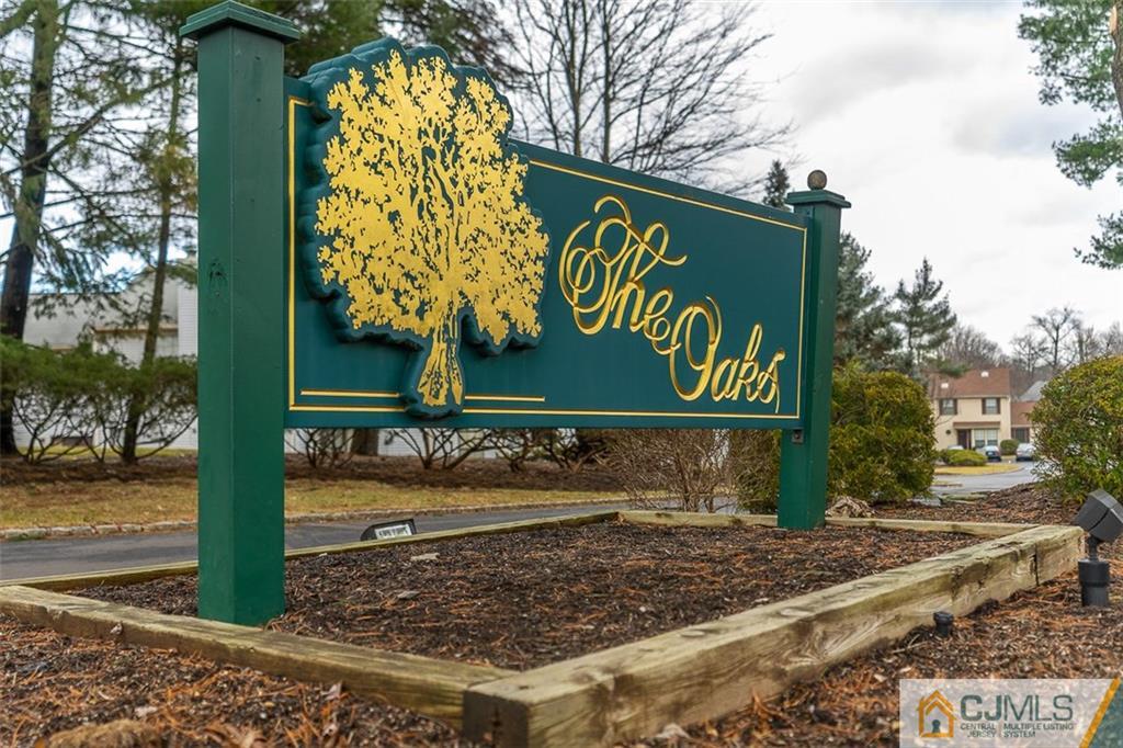 605 Timber Oaks Road, Unit 605 Edison, NJ 08820 - Photo 22 of 22 a sign broad on the side of the road