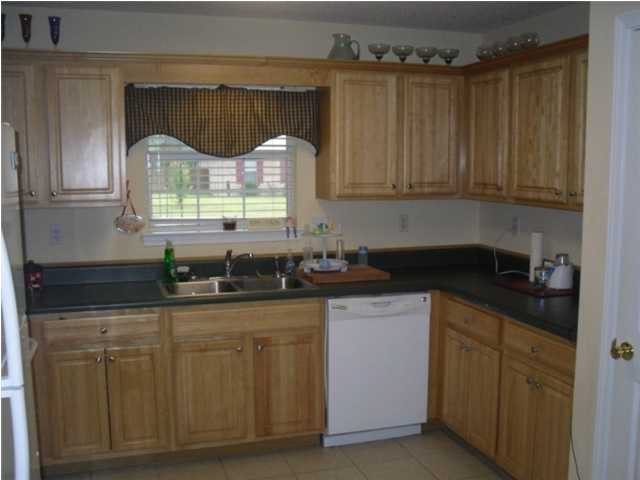 4821 Acorn Drive Crestview, FL 32539 - Photo 15 of 25 a kitchen with granite countertop a sink a window and cabinets