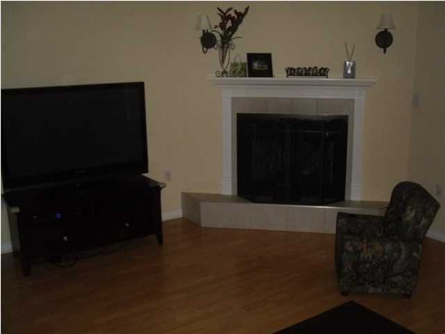 4821 Acorn Drive Crestview, FL 32539 - Photo 18 of 25 a living room with furniture and a fireplace