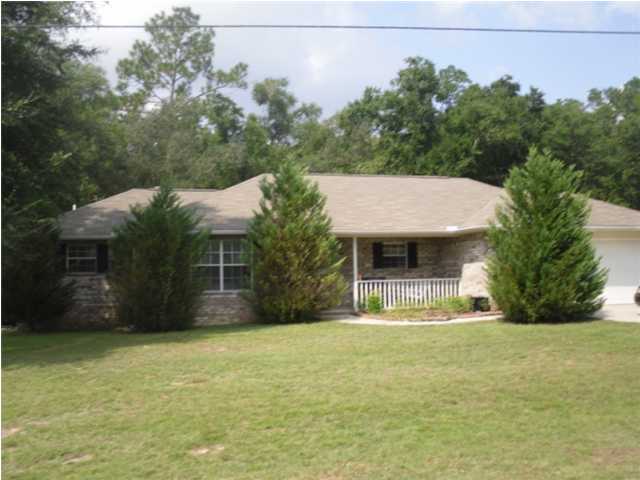 4821 Acorn Drive Crestview, FL 32539 - Photo 20 of 25 a front view of a house with a yard