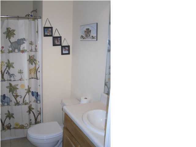 4821 Acorn Drive Crestview, FL 32539 - Photo 24 of 25 a bathroom with a sink toilet and shower