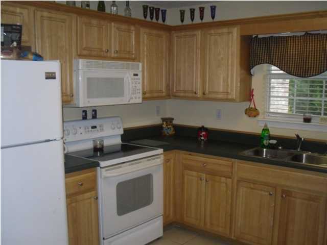 4821 Acorn Drive Crestview, FL 32539 - Photo 6 of 25 a kitchen with stainless steel appliances granite countertop a sink a stove a refrigerator and cabinets