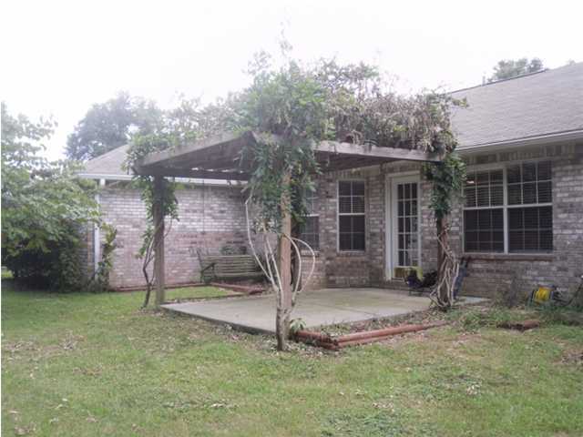 4821 Acorn Drive Crestview, FL 32539 - Photo 8 of 25 a front view of a house with garden