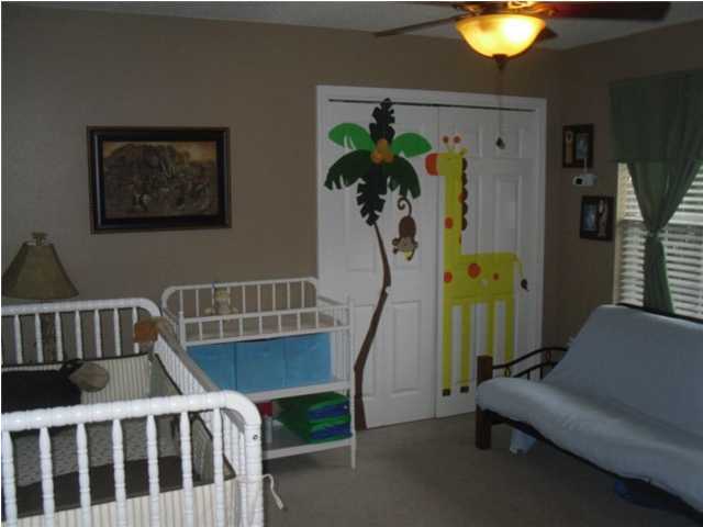 4821 Acorn Drive Crestview, FL 32539 - Photo 9 of 25 a view of a bedroom with furniture and a window