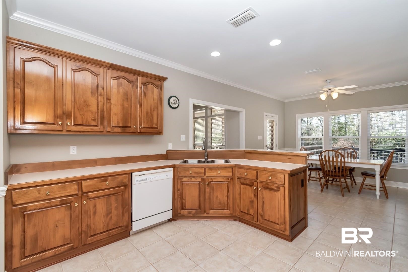 6090 Celeste Road Saraland, AL 36571 - Photo 13 of 38 Kitchen with a sink, dishwasher, a peninsula, visible vents, and ceiling fan