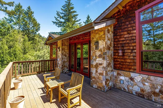 a view of a two chairs and table in the balcony