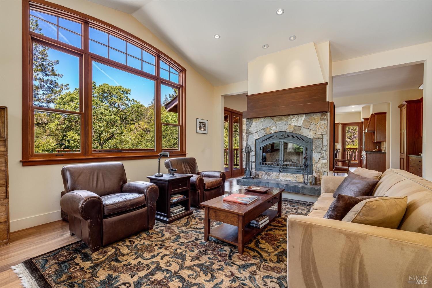 2207 Mt Veeder Road Napa, CA 94558 - Photo 5 of 36 a living room with furniture fireplace and a large window