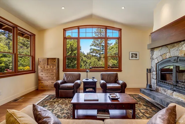 a living room with furniture fireplace and flat screen tv