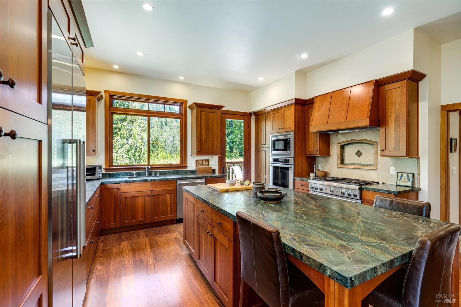 2207 Mt Veeder Road Napa, CA 94558 - Photo 10 of 36 a kitchen with stainless steel appliances granite countertop a stove a sink and a refrigerator
