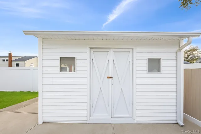 a view of a house with a yard and deck