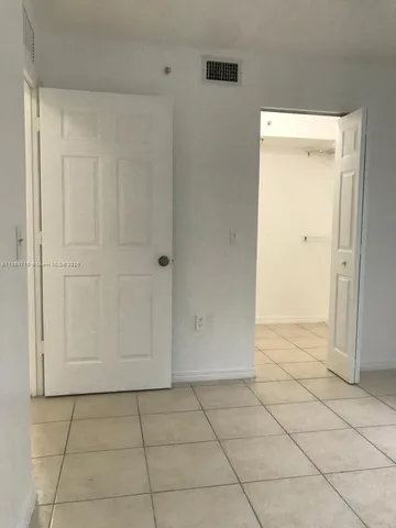 a bathroom with a toilet a sink a mirror and bathtub