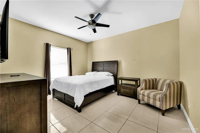 a bedroom with a bed and couch