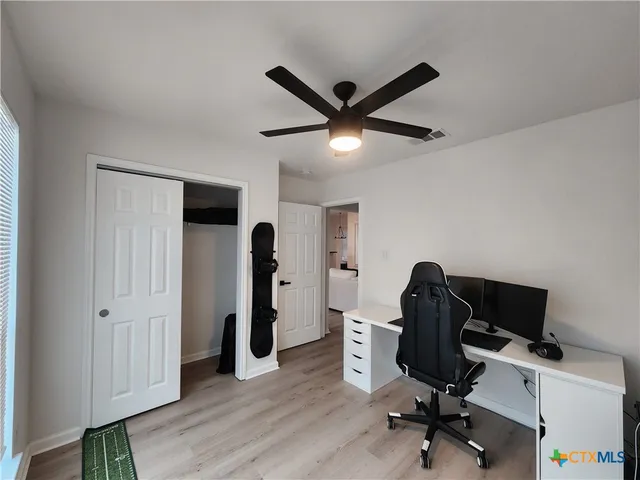 a bedroom with furniture and a window
