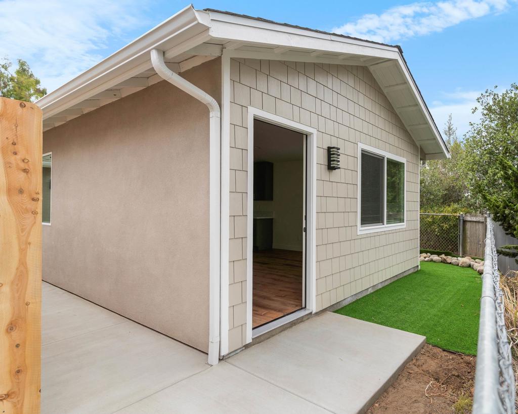 a view of front door and yard