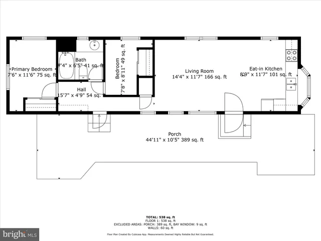 a front view of a house with outdoor seating