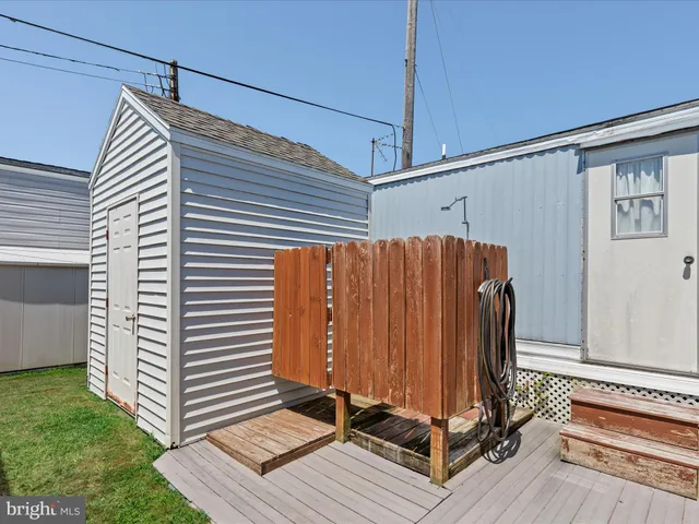 a view of a patio with a table and chairs